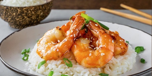 Honey, sesame, and orange king prawns